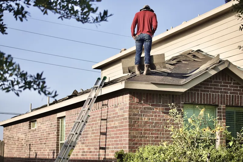 Professional roofer working on a residential roof in Bulverde